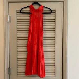 Bright coral dress with cinched waist